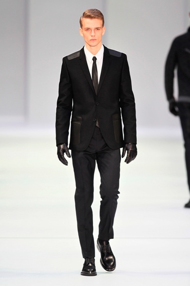 BERLIN, GERMANY - JANUARY 17:  A model walks the runway at Hugo By Hugo Boss Autumn/Winter 2013/14 fashion show during Mercedes-Benz Fashion Week Berlin at Opernwerkstatte on January 17, 2013 in Berlin, Germany.  (Photo by Peter Michael Dills/Getty Images for Mercedes-Benz)